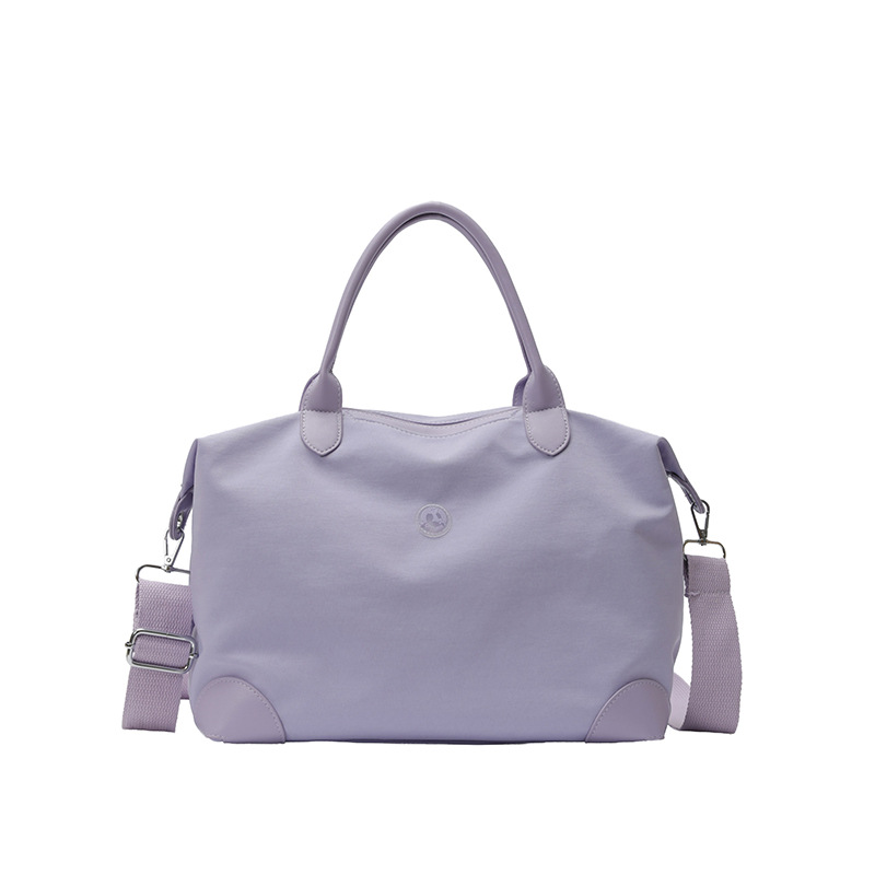Nueva bolsa coreana para niños, bolsa de viaje ligera de gran capacidad, bolsa de mano casual simple de color sólido para niños y niñas