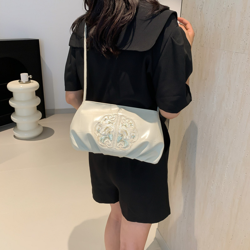 Nuevo estilo chino bordado bolso pequeño mujer 2024 nuevo plegado estilo extranjero empalme viaje al trabajo mochila de hombro
