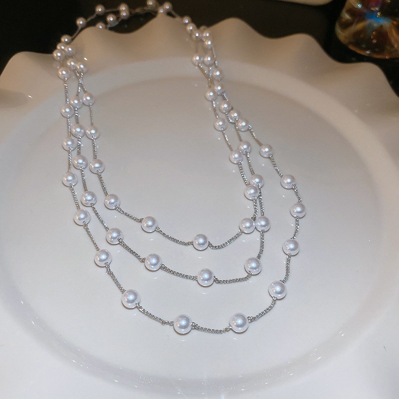 Collar con cuentas de perlas de gota de agua con diamantes transfronterizos otoño e invierno cadena de suéter de lujo ligero francés moda todo fósforo joyería de alta gama