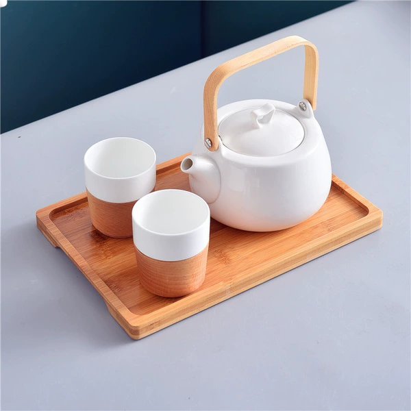 One pot, two cups, wooden cups and bamboo plate
