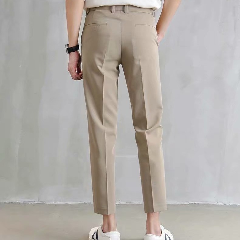 Los fabricantes de origen pantalones pequeños negros pantalones cortos para hombres, pantalones de traje ajustados rectos con sentido de tendencia, pies pequeños, versión coreana casual