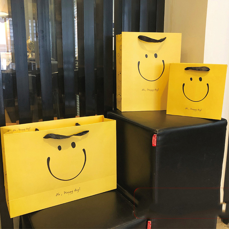 笑脸高档手提袋纸袋logo礼品袋服装袋幼儿园网红木盒设计即食水果