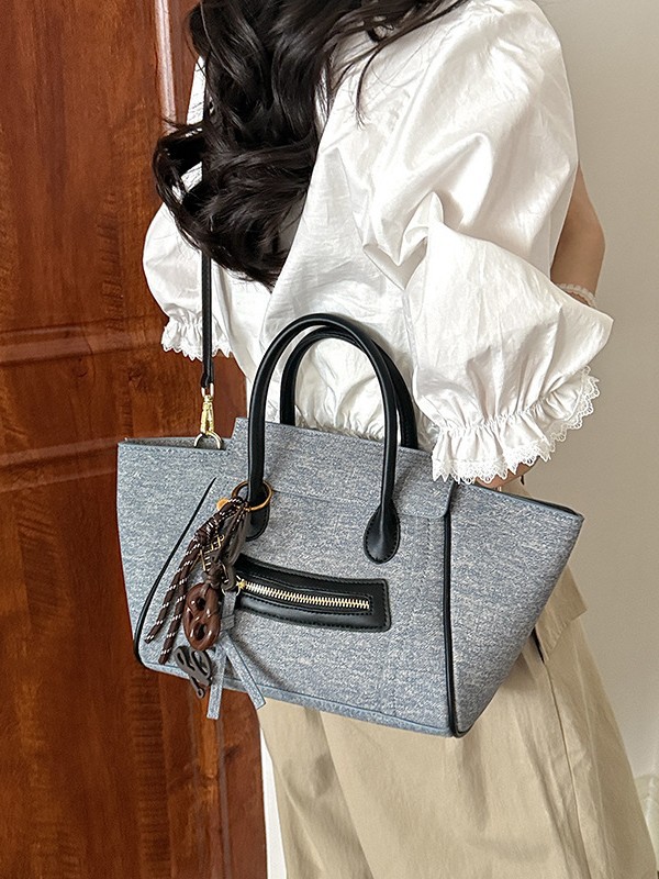 Bolso para mujeres 2026 comercio exterior nuevo bolso de mano de gran capacidad de alta calidad color contraste commuting cara sonriente bolso de mochila