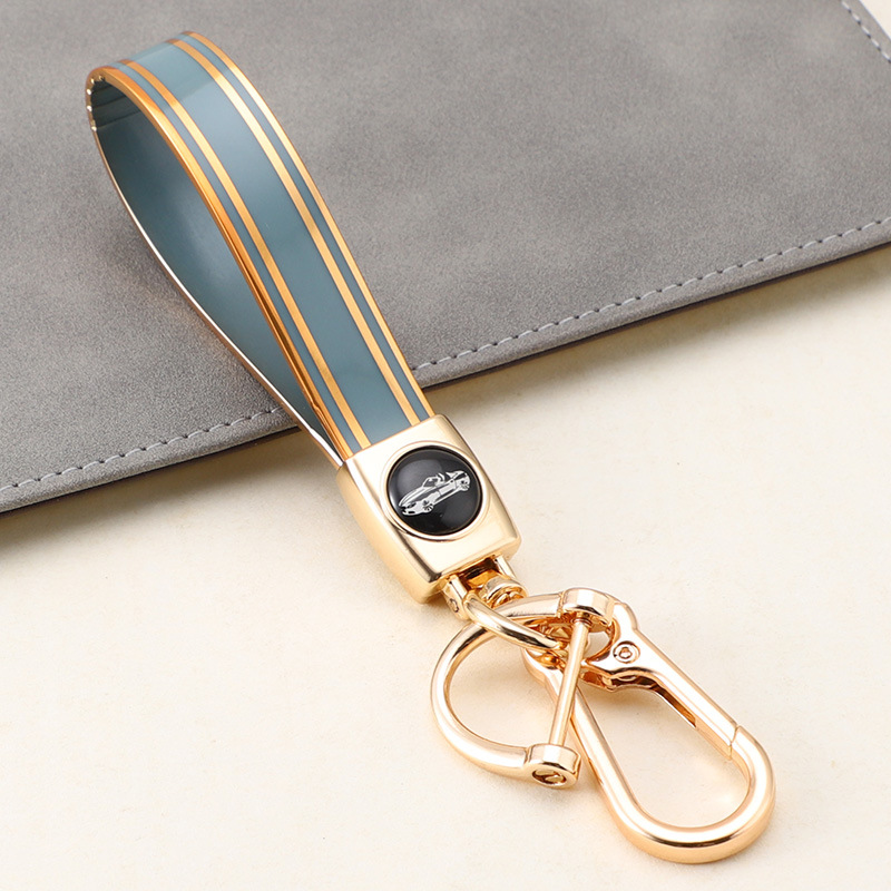 Cuerda de mano de silicona transfronteriza llavero de coche logotipo de coche apellido llavero anti-pérdida llavero de cuerda de mano de silicona duradera