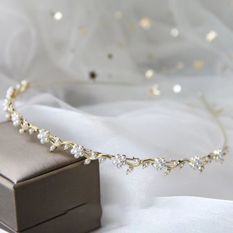 Accesorios para el cabello de alto sentido femenino Socialite nicho súper Hada temperamento diadema dulce ojo de gato perla diadema accesorios para el cabello francés