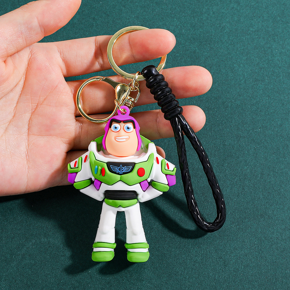 Llavero de silicona de Toy Story, el popular dibujo animado, con personajes como el alienígena de tres ojos, Buzz Lightyear y el oso Lotso, ideal como adorno para bolso.