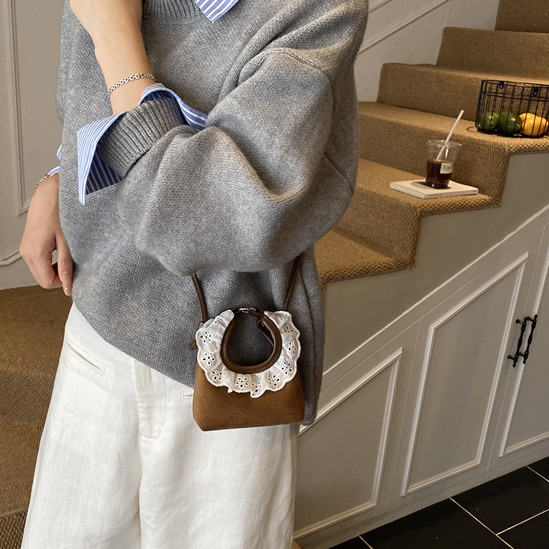 Bolsa de mano de encaje coreano para niñas, mini lindos bebés mochila simple de color sólido para niños.