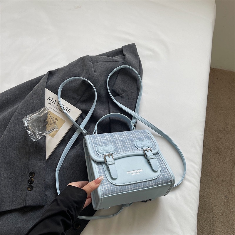Mochila universitaria popular para estudiantes mochila casual de mujer estilo a cuadrícula nicho 2026 escuela de moda de verano nuevo estilo