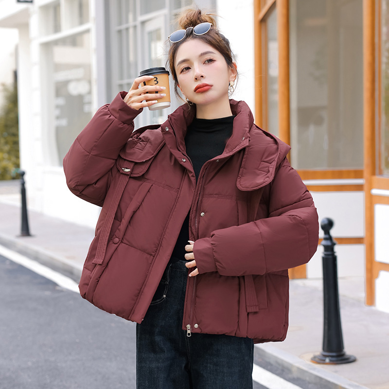 Corea del Sur Dongdamen ropa de algodón de pluma para mujeres corto 2025 invierno nuevo algodón delgado chaqueta con capuz transfronteriza