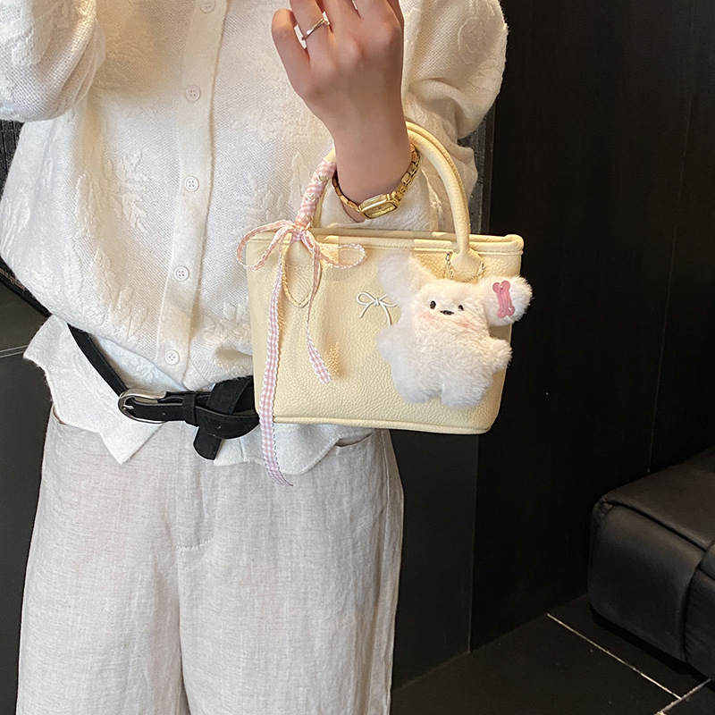 Bolsa de balde coreana para niñas estilo extranjero simple color sólido mini bebé bolsa de cesta de verduras 2026 nuevo bolso para niños