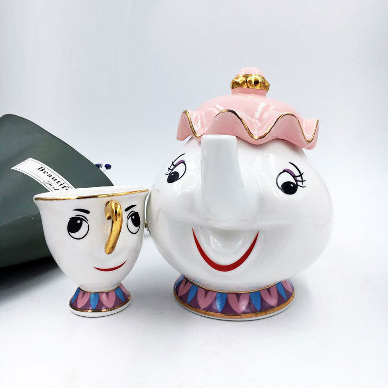 新版のティーポットの美人と野獣のティーポットの陶磁器の金メッキのティーポットのお茶の鍋の奥さんの現物の皿の砂糖の缶|undefined