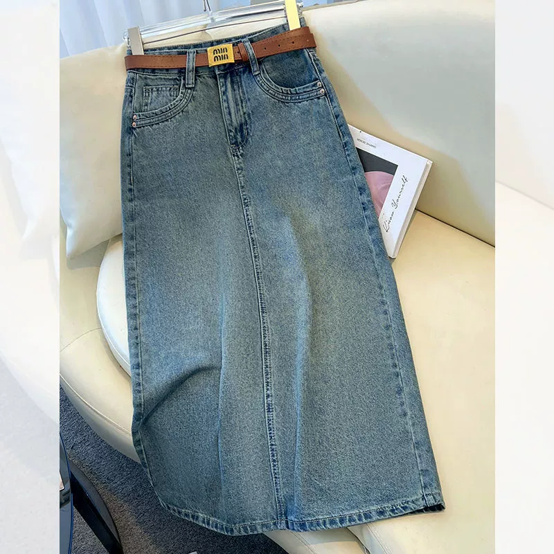 Джинсовая юбка больших размеров с высокой талией для женщин, новый стиль лета 2025 года, универсальная утягивающая облегающая юбка средней длины А-силуэта.