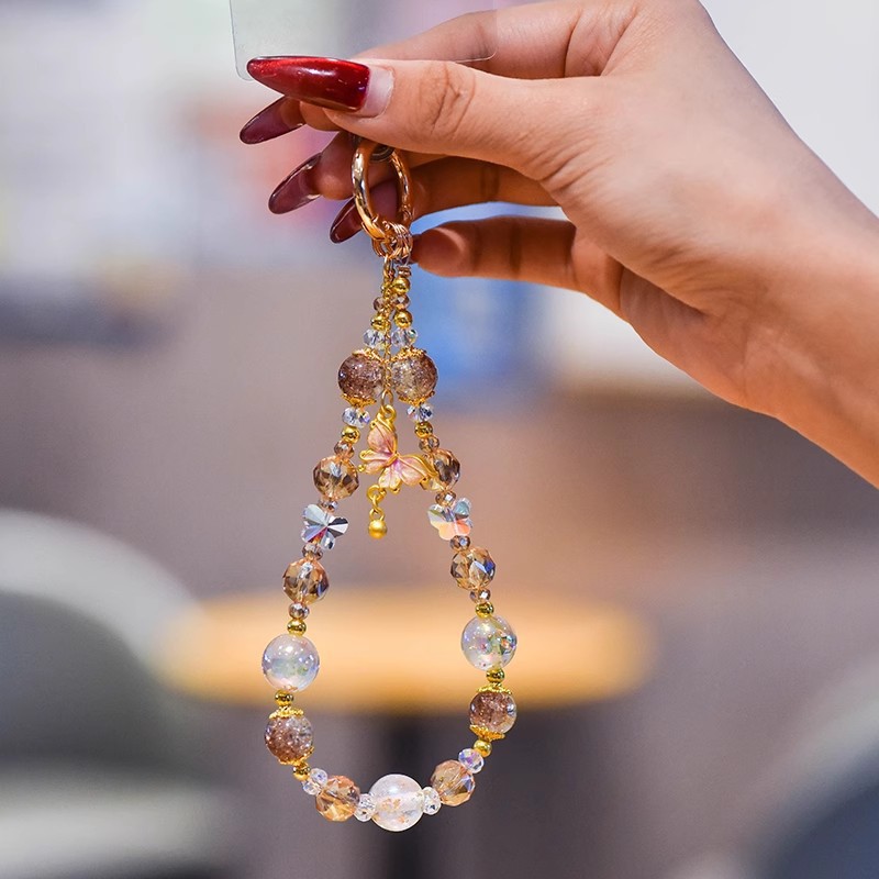 Nuevo estilo chino de alta calidad cadena de teléfonos móviles cristal ligero lujoso viento dorado colgante mariposa frillera corta cuerda de caso de teléfono móvil