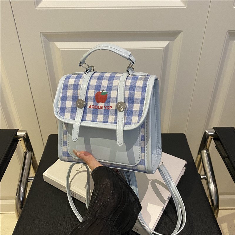 Color contrastante estampado a cuadrícula pequeña y fresca mochila de clase nueva versión coreana de transporte múltiple mochila de moda