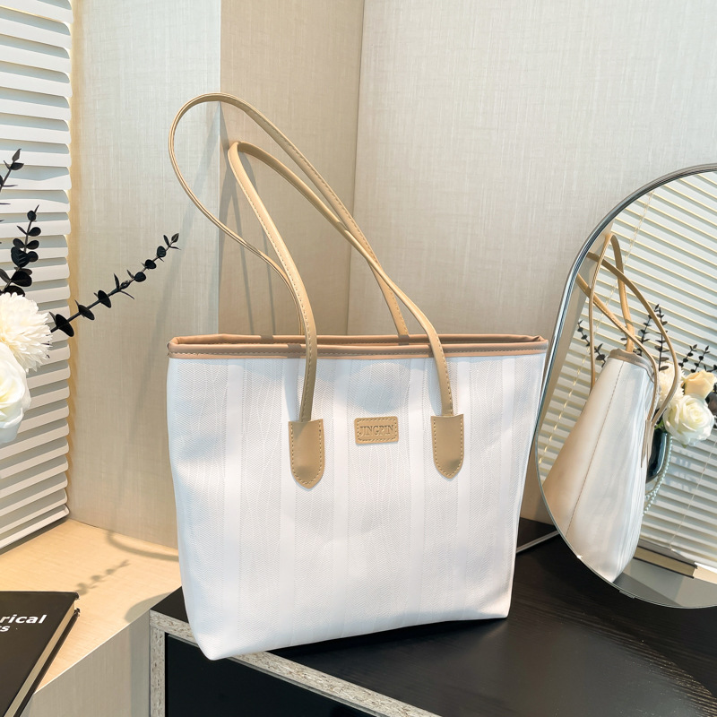 Bolso coreano nicho ZhongTote 2026 nuevo estilo de moda de mujer bolso de hombro de color sólido simple bolso de gran capacidad