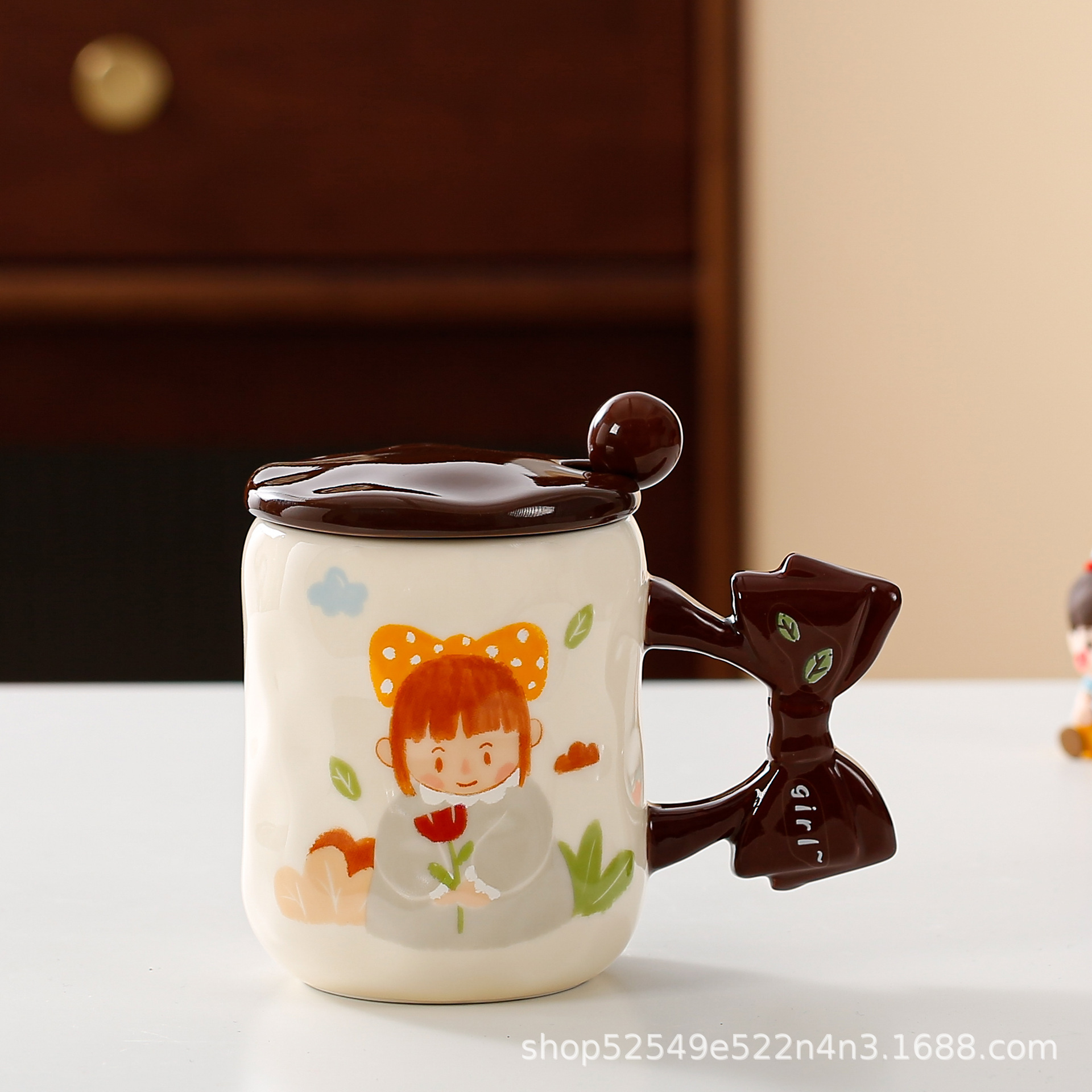 Arco de dibujos animados transfronterizos mango taza de cerámica taza de agua de alto valor taza de regalo con taza de café cuchara cubierta