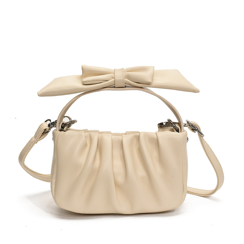 Versión coreana del bolso de nube de niña de color sólido simple estilo occidental pliegue lindo lazo bolso de bebé nuevo bolso para niños