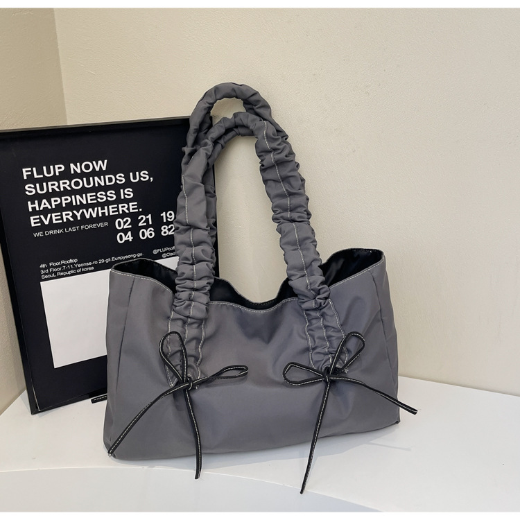 Bolsa de hombro de nicho coreano, bolso de viaje de arco, bolso de mano de mujer, bolso casual de gran capacidad, simple.