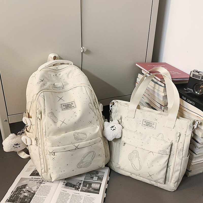 Cross-border 2026 nicho universal estrellas auriculares mochila de gran capacidad mochila de graffiti de viaje de estudiantes universitarios