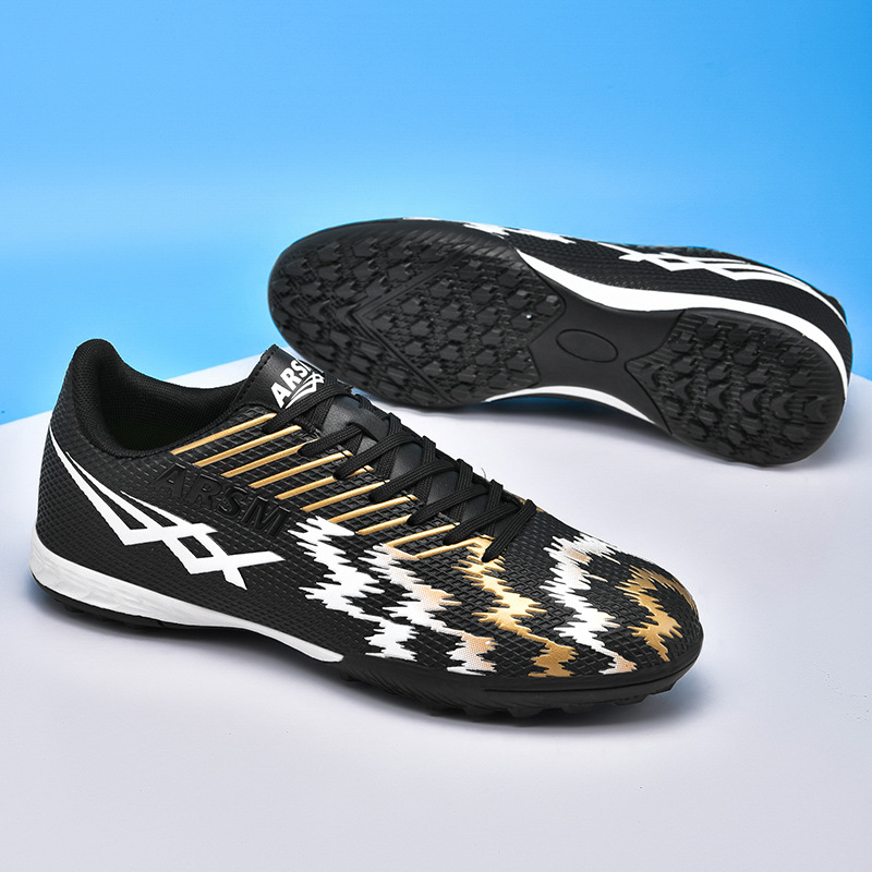 Comercio exterior transfronterizo nuevas zapatillas de fútbol deportivas bajas al aire libre para hombres y mujeres zapatillas de entrenamiento con clavos artificiales para estudiantes