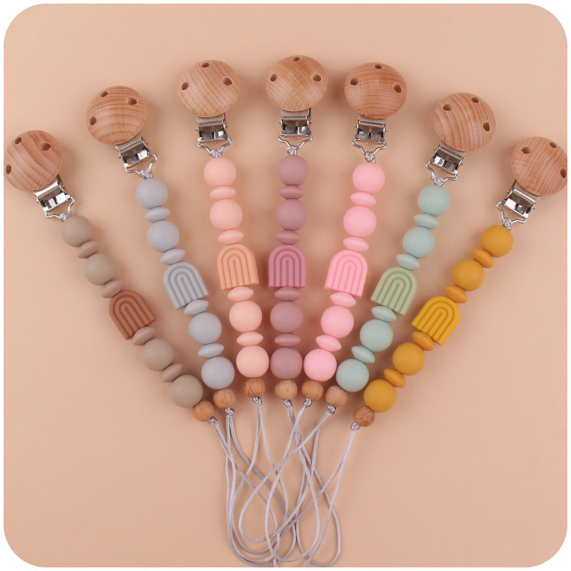 Nuevo bebé suministros de dibujos animados Arco Iris chupete cadena calmante bebé Arco Iris clip hecho a mano tejido anti-gota