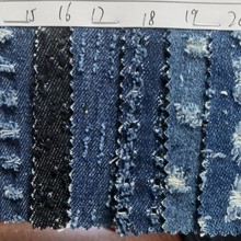 10*10涤棉牛仔冲孔扎花水洗布料破洞勾花设计无弹提花牛仔面料