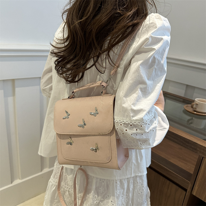 Mochila de mujer casual de estilo exterior versátil 2024 verano nuevo viaje de alta calidad mariposa mini mochila