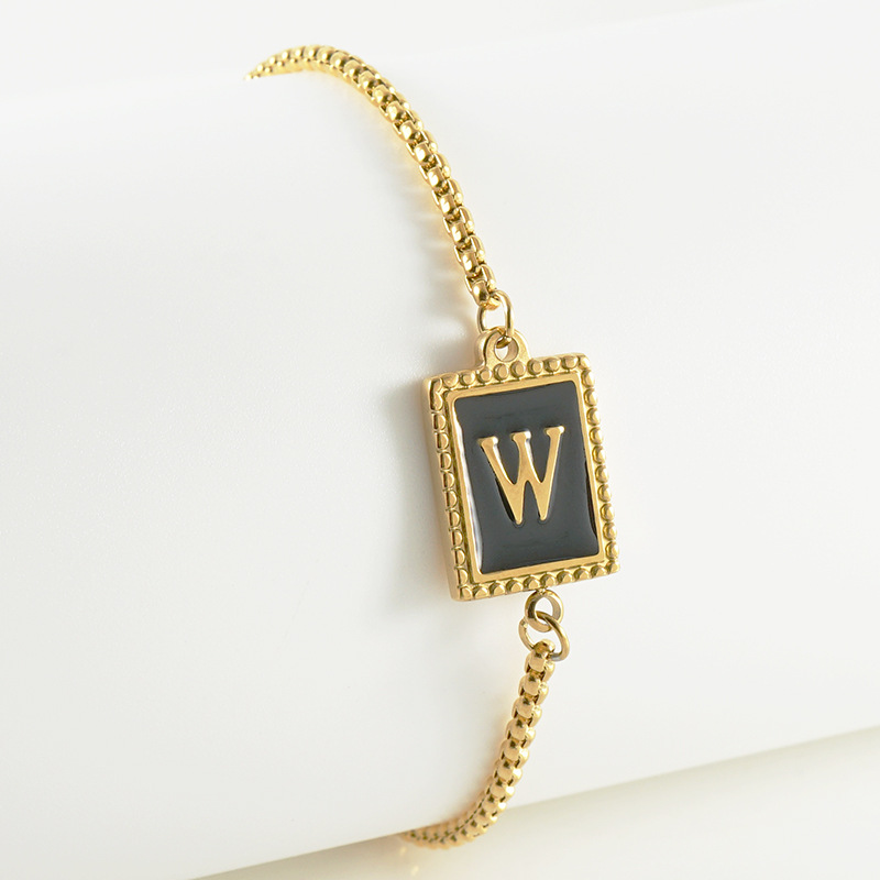 La moda europea y americana transfronteriza del acero inoxidable 26 pulsera inglesa de la letra en relieve pulsera Titanium de la cremallera del acero 18K de la frontera para las mujeres