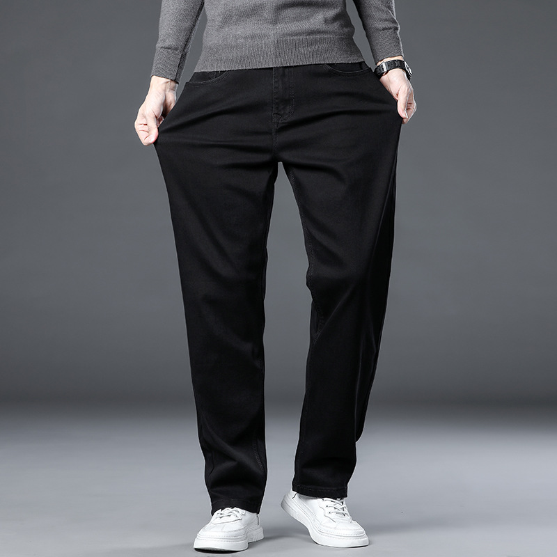 Ventas directas de fábrica de primavera y otoño Xintang pantalones elásticos para hombres jeans sueltos rectos pantalones largos para hombres de pierna ancha de marca de moda para hombres