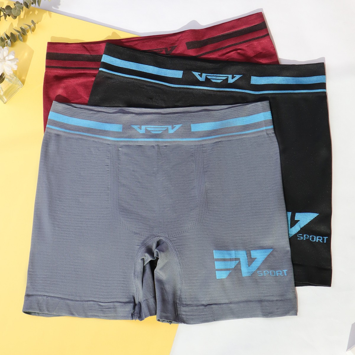 Calzoncillos bóxer deportivos para hombre, de cintura media, sin costuras, de poliéster elástico, transpirable, con sensación de desnudez, de color sólido, de pierna larga.