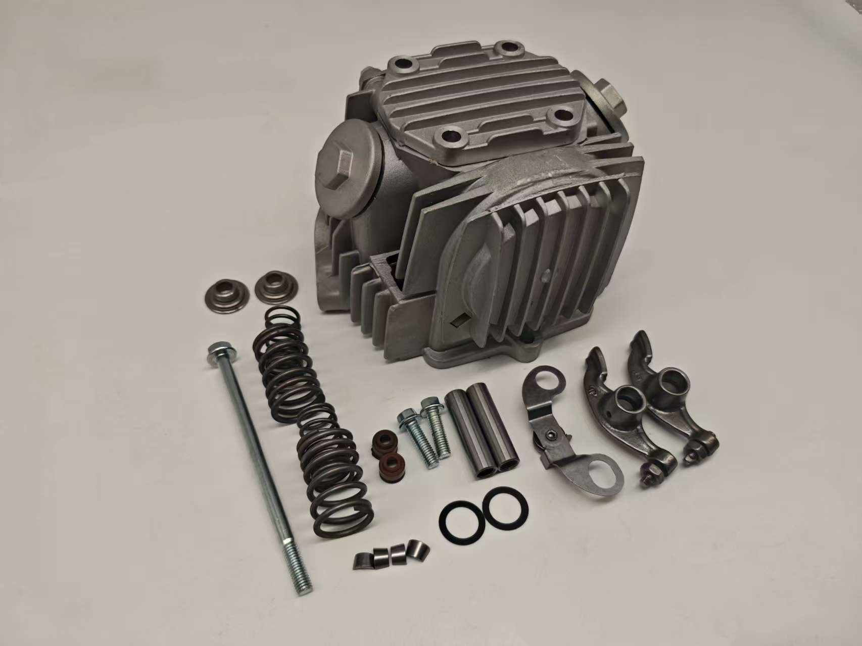 This T WAVE100 European cylinder head assembly is for the NF100 scooter, an OHC chain engine cylinder head component