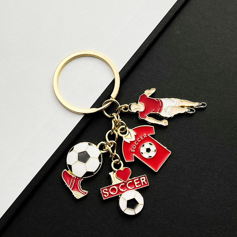 国境を越えてよく売れています。サッカー選手のユニホーム靴のキーホルダーは金属部品のワールドカップの周辺プレゼントです。|undefined
