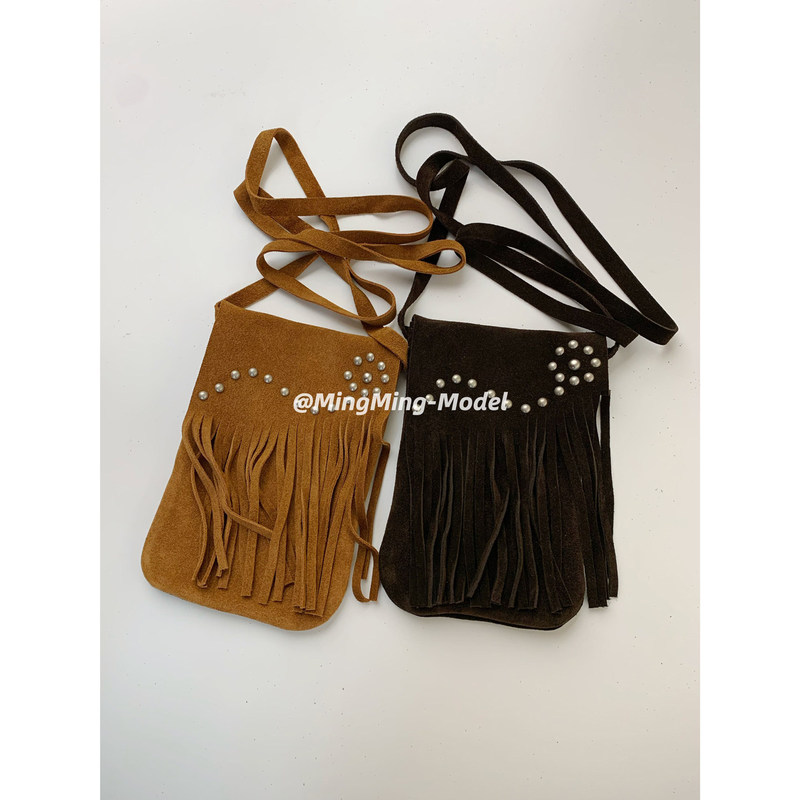 Maillard-style suede flap phone bag with a western wasteland vibe and tassel design, lightweight crossbody bag for women