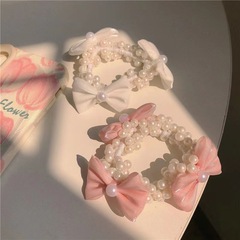 韓国版の気質の早春の蝶結びの真珠の髪のひものゴムの筋は髪の毛の高級感の仙気の簡単な髪飾りを刺します。