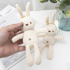 トウモロコシのウサギのぬいぐるみのウサギのぬいぐるみの小さいサイズのトウモロコシの格子のウサギの服装は包みをつけてウサギを飾ります。