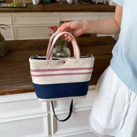 韩版大容量编织拼接包撞色水桶包夏季2025新款托特包慵懒风包条纹