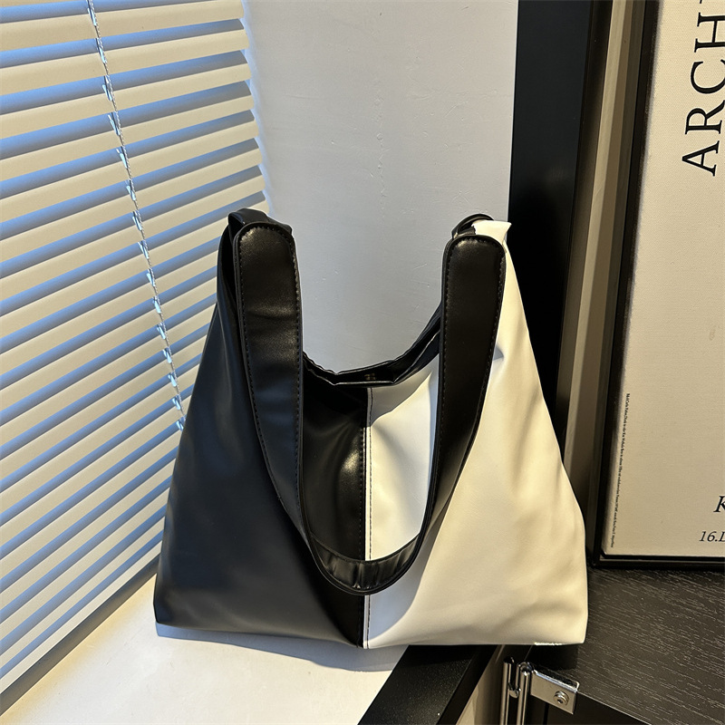 Bolsa de mujer de gran capacidad, textura de 2024, nueva moda simple, bolsa de hombro universal, bolsa de brazo de viaje de color.