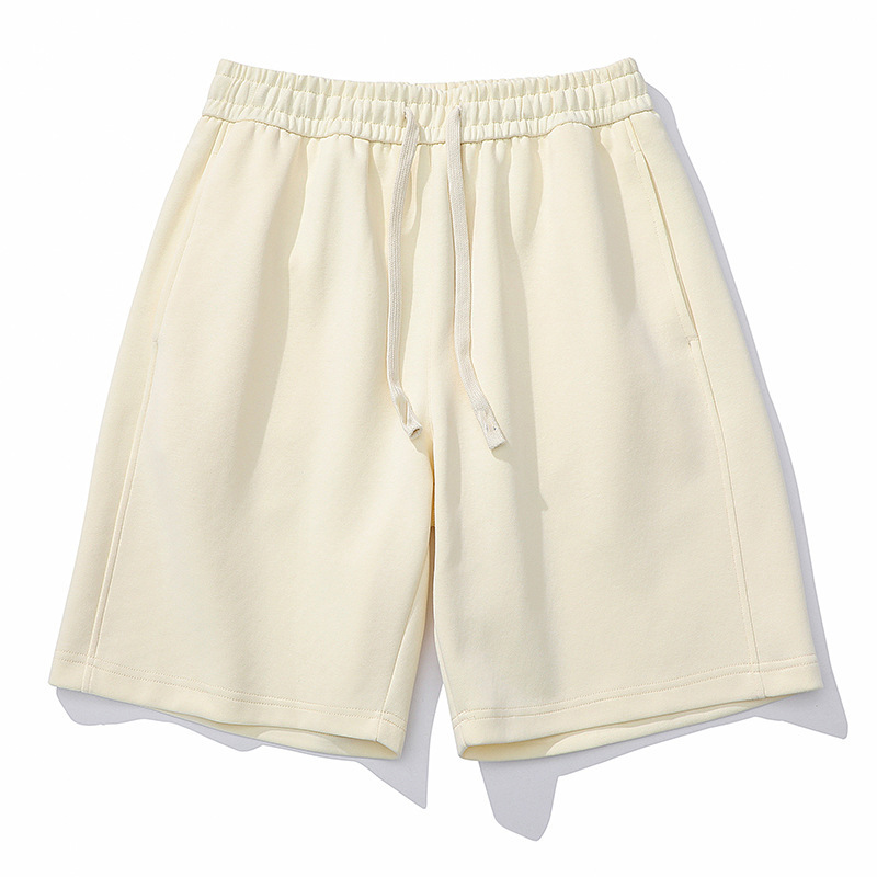 Nuevas tendencias pantalones cortos de cinco puntos de color sólido de verano versión coreana de pantalones deportivos casuales para hombres