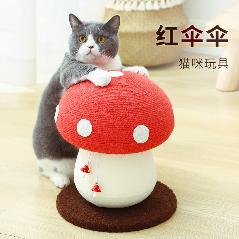 新年の赤い傘のキノコの猫は棚の剣の麻を登って爪の猫をつかんで板をつかみません。|undefined