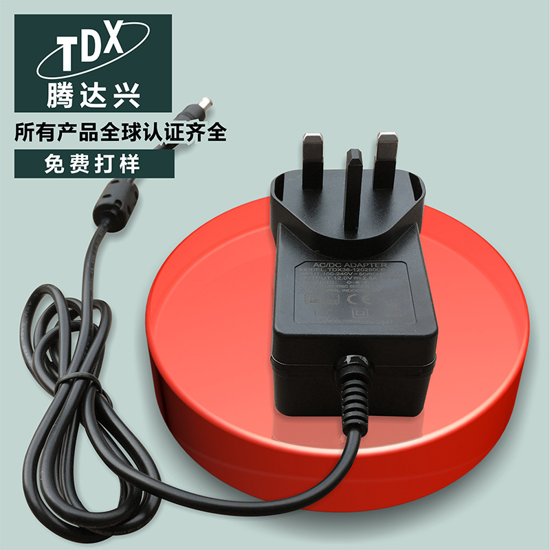 Spot 12V2.5A British power adapter TV set-top box switching power supply sweeping machine power adapter