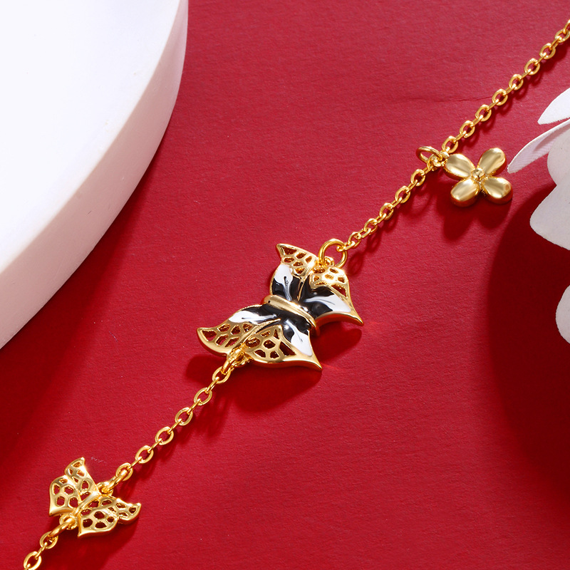 Xuping aleación de cobre dorado esmalte goteo de aceite pulsera mariposa mujer retro lujo ligero nicho diseño de alta sensación joyería