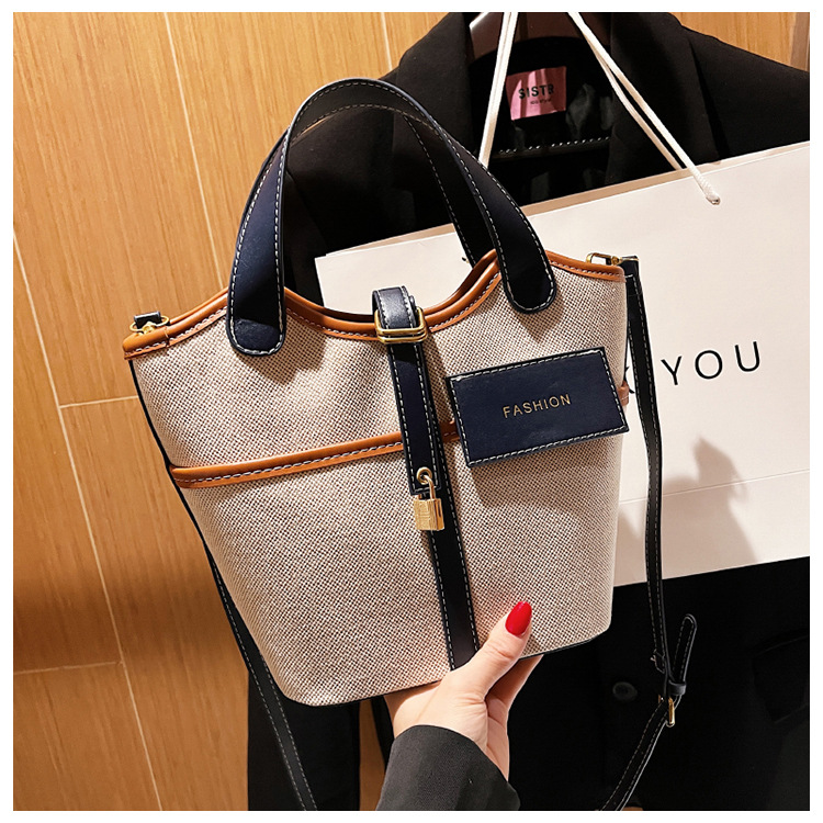 Bolso de lona para mujer 2026, nuevo diseño de nicho, bolso de mano tipo cubo, bolso retro de moda, bolso de hombro cruzado tipo cesta