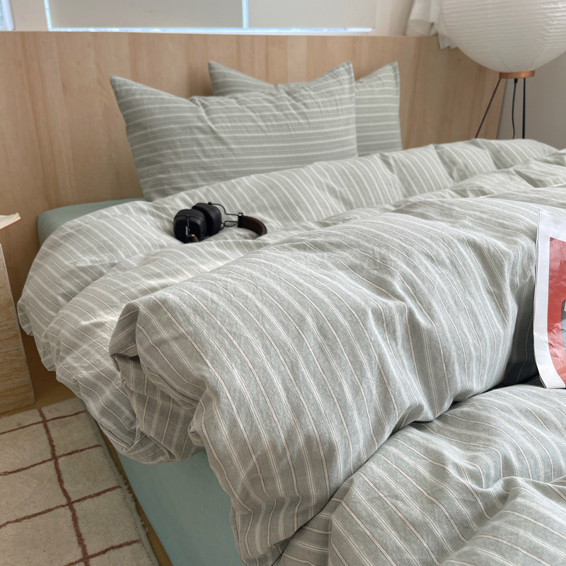 Una clase de algodón cuatro piezas de tejido de agua lavado sábanas de algodón cubierta dormitorio de estudiantes cama de tres piezas de impresión y teñido activo