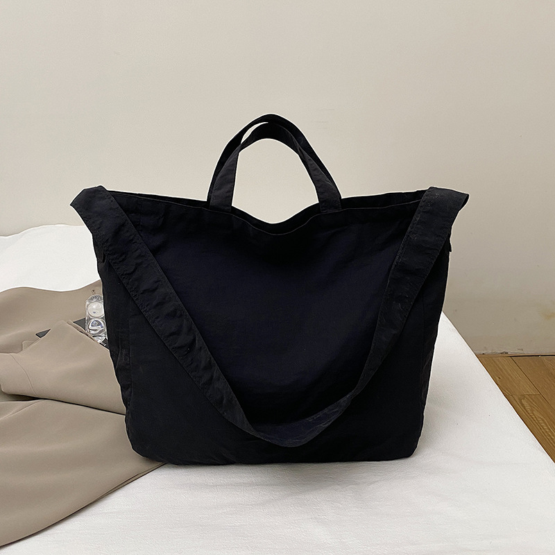 Simple relajado sensación de gran capacidad bolso de lona de hombro de mujer hollow viento versátil bolso de mochila