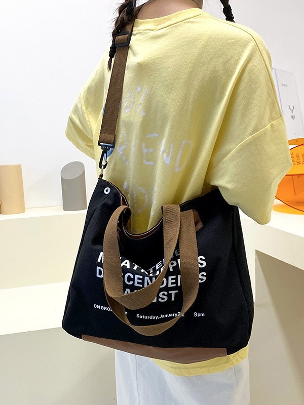 Bolso de lona de alta capacidad, nuevo tipo de bolso de viaje escolar, simple y versátil bolso de hombro.
