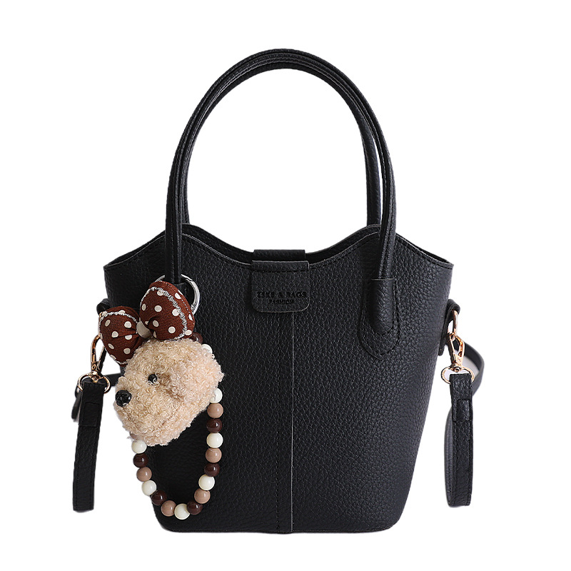 Bolso de mano de moda retro 2026 nuevo temperamento simple bolso de cubo de viaje ocio mochila de hombro