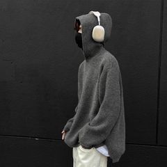 怠惰な風と帽子のセーターの男性は秋冬にアメリカの高街のニットのごろつきを厚くします。