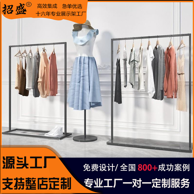 Elegante expositor de ropa para mujer, estilo isla, para tiendas, estante de exhibición de ropa de pie para la venta.