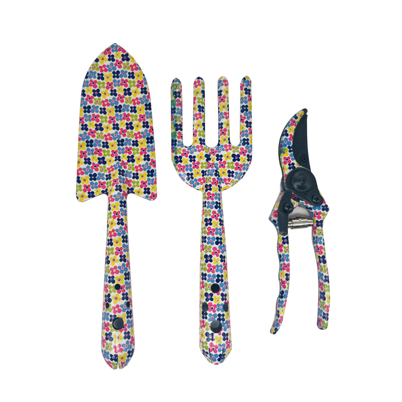 Herramientas al aire libre textura de impresión de flores pequeñas herramientas de jardín conjunto de tres piezas de impresión pala jardín flores y plantas herramientas de jardinería