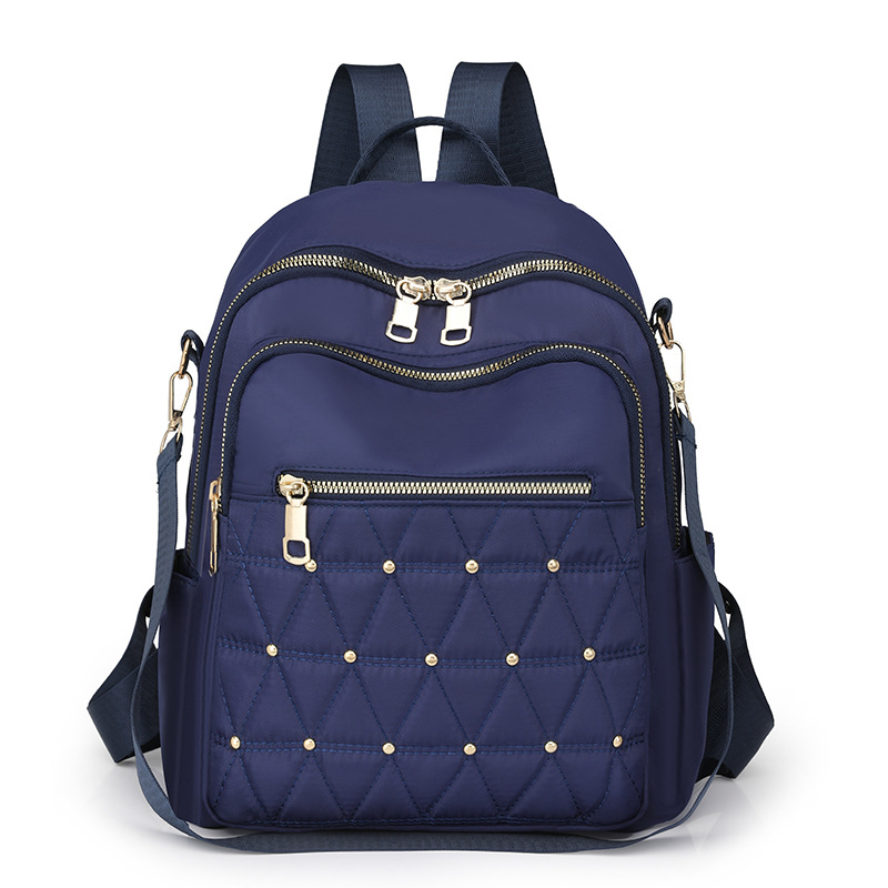 Mochila con remaches bordados de ringge para mujer 2025 nueva bolsa de viaje de moda casual todo-fósforo de gran capacidad para mujer